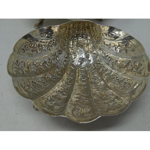 313 - A Pair of Indian Silver (Unmarked but testing as fine silver) Shell Form Dishes decorated with Anima... 