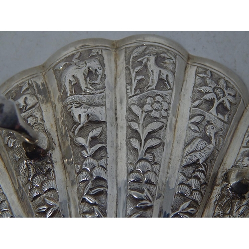 313 - A Pair of Indian Silver (Unmarked but testing as fine silver) Shell Form Dishes decorated with Anima... 