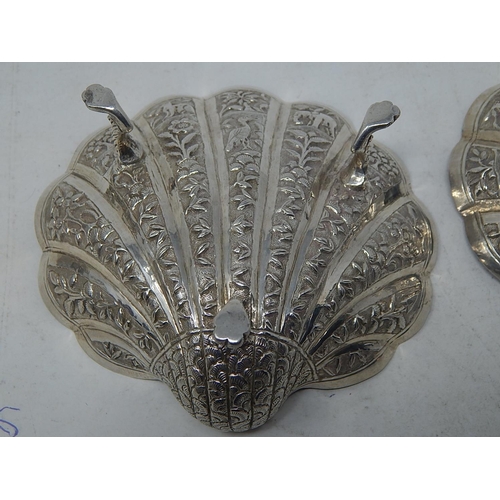 313 - A Pair of Indian Silver (Unmarked but testing as fine silver) Shell Form Dishes decorated with Anima... 