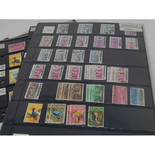 228 - Enormous collection of stamps housed on many large Double Sided Hagner Sheets inc Hong Kong, Malaysi... 