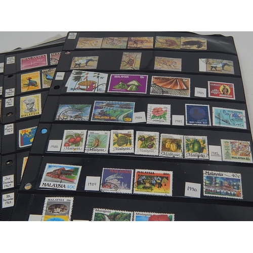 228 - Enormous collection of stamps housed on many large Double Sided Hagner Sheets inc Hong Kong, Malaysi... 