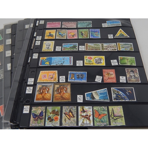 228 - Enormous collection of stamps housed on many large Double Sided Hagner Sheets inc Hong Kong, Malaysi... 