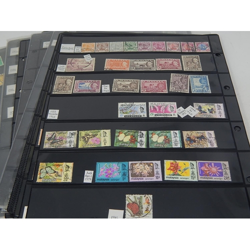 228 - Enormous collection of stamps housed on many large Double Sided Hagner Sheets inc Hong Kong, Malaysi... 