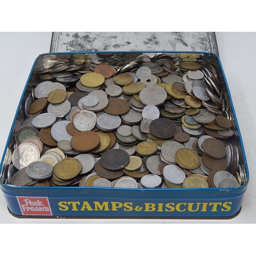 206 - Large tin of World coinage totally unsorted weighing 6.9 kilos gross