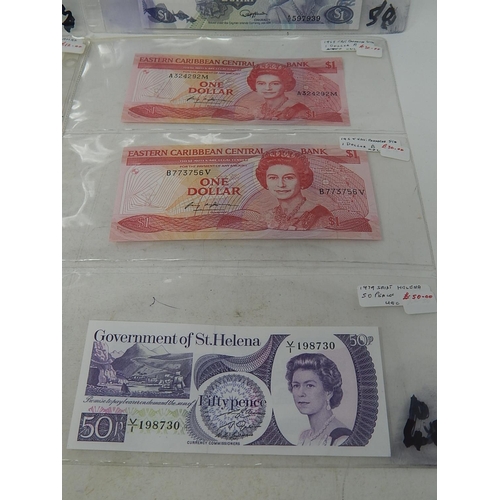 95 - A selection of 12 x Commonwealth Banknotes all in crisp Uncirculated condition