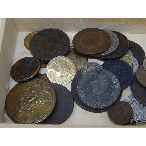 110 - A Fortnum and Mason box containing an interesting selection of coins and tokens