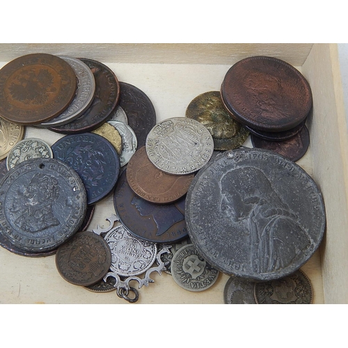 110 - A Fortnum and Mason box containing an interesting selection of coins and tokens