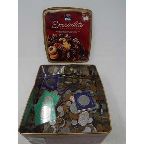 181 - Accumulation of GB and World coinage in a vintage biscuit tin