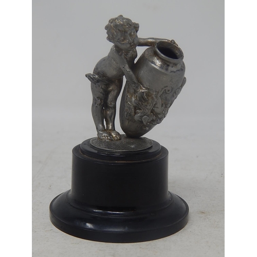 801 - White Metal Figure of a Putti holding an urn: Measures 9cm high