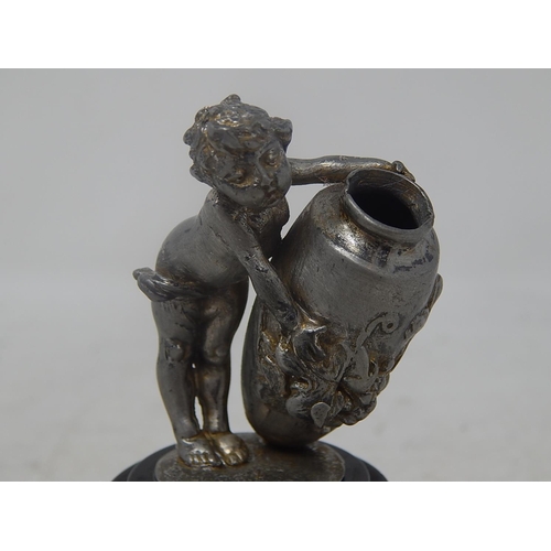 801 - White Metal Figure of a Putti holding an urn: Measures 9cm high