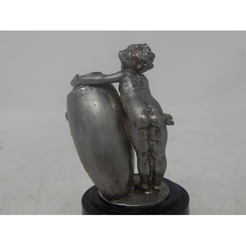 801 - White Metal Figure of a Putti holding an urn: Measures 9cm high