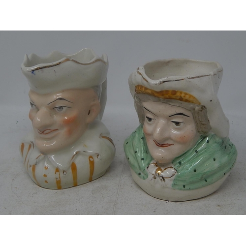 802 - Two Early C20th Toby Jugs of a man and woman.