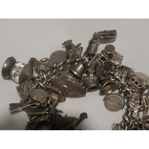 363E - Heavy Silver Charm Bracelet with Numerous Charms: Gross weight 147g