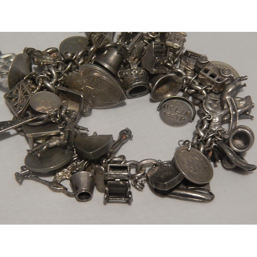 363E - Heavy Silver Charm Bracelet with Numerous Charms: Gross weight 147g