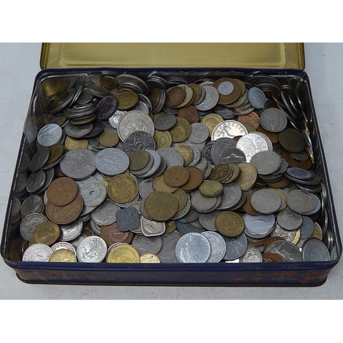 29 - A vintage tin full of coinage of the world toally unsorted and unchecked