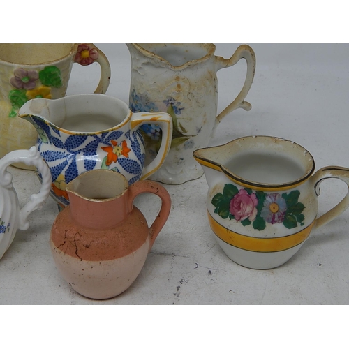 755 - Selection of miniature jugs