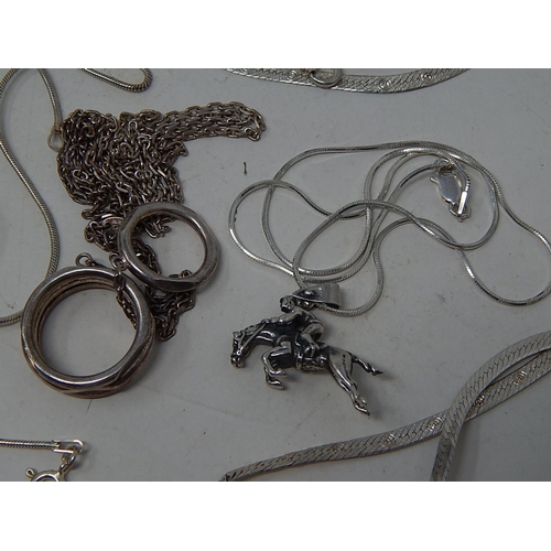 202 - Five Silver Necklaces, some with pendants.