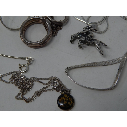 202 - Five Silver Necklaces, some with pendants.