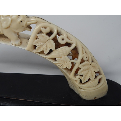 308 - Late Victorian Ivory Elephant Tusk (Bridge of Elephants) on its original wooden stand. Tusk Measures... 