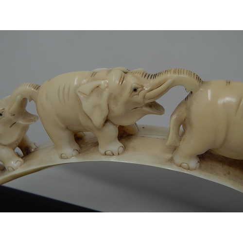 308 - Late Victorian Ivory Elephant Tusk (Bridge of Elephants) on its original wooden stand. Tusk Measures... 