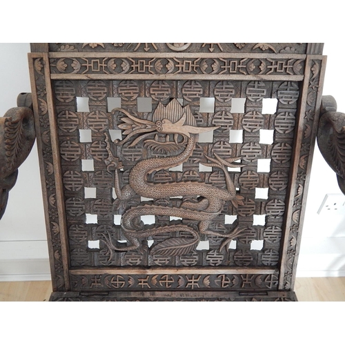 313 - 19th Century Chinese Folding Chair Profusely Carved with Dragons & Character Marks. The Folding Arms... 