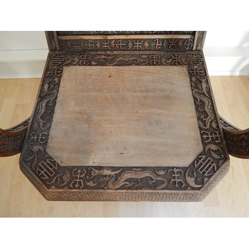 313 - 19th Century Chinese Folding Chair Profusely Carved with Dragons & Character Marks. The Folding Arms... 