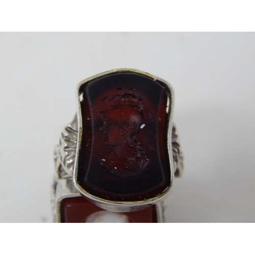 224 - Two silver rings, marked, one amethyst intaglio and one cameo. Roman warrior
designs.