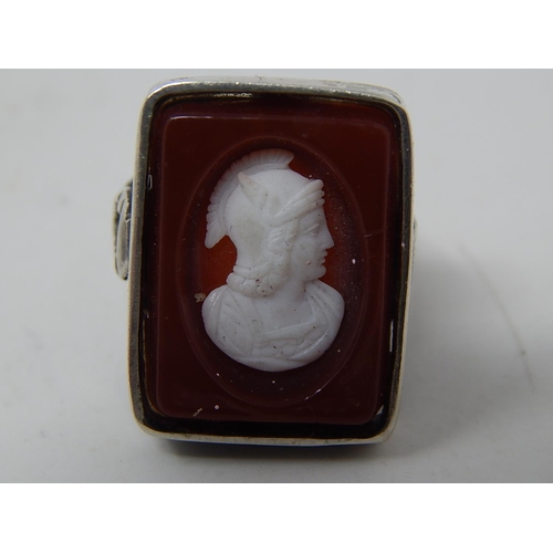 224 - Two silver rings, marked, one amethyst intaglio and one cameo. Roman warrior
designs.