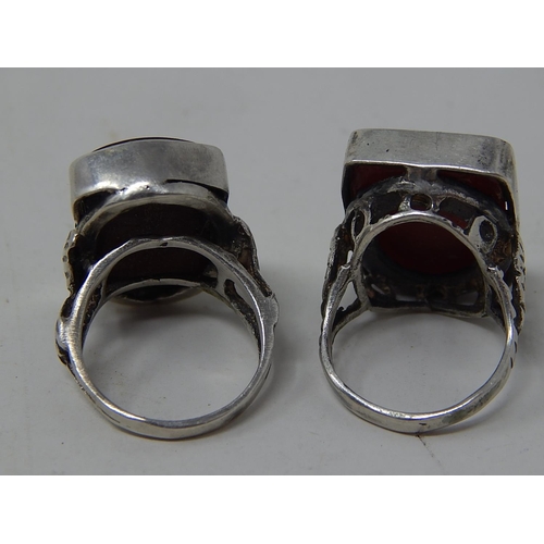 224 - Two silver rings, marked, one amethyst intaglio and one cameo. Roman warrior
designs.