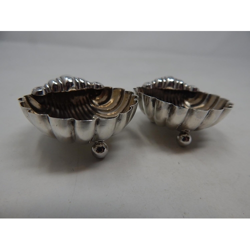 139 - Pair of Victorian silver scallop shell shaped salts, Birmingham 1895