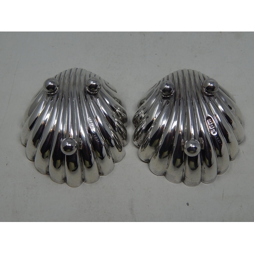 139 - Pair of Victorian silver scallop shell shaped salts, Birmingham 1895