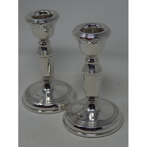 150 - Pair of silver candlesticks, 11.2 cm high, Birmingham 1976