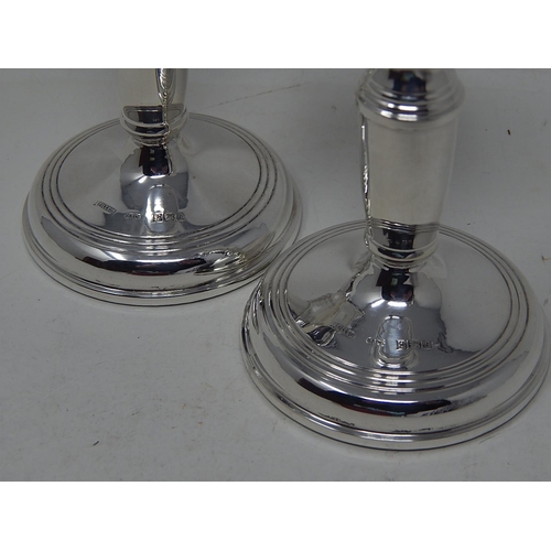 150 - Pair of silver candlesticks, 11.2 cm high, Birmingham 1976