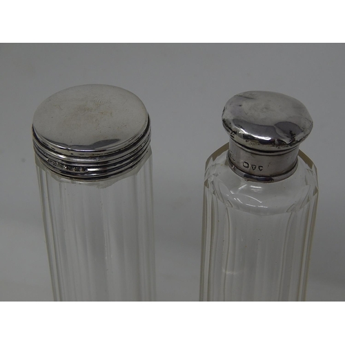 185 - Two tall silver topped perfume bottles & small silver topped perfume bottle with stopper,
London... 