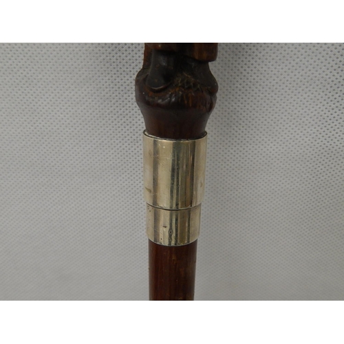 332 - Folk art walking cane. Carved figure on handle and hallmarked silver collar 1928.
L88cm