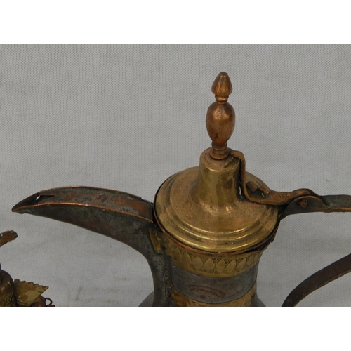 336 - Two mixed metal dallah middle eastern coffee pots.
Tinned copper & brass.
H 270mm and H 210mm.