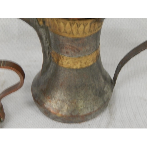 336 - Two mixed metal dallah middle eastern coffee pots.
Tinned copper & brass.
H 270mm and H 210mm.