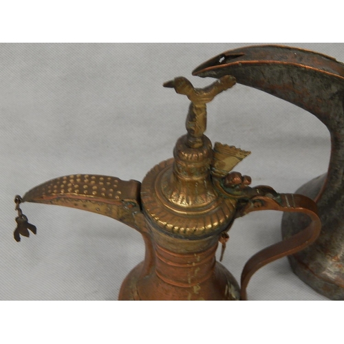 336 - Two mixed metal dallah middle eastern coffee pots.
Tinned copper & brass.
H 270mm and H 210mm.