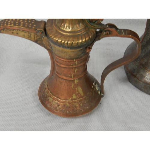 336 - Two mixed metal dallah middle eastern coffee pots.
Tinned copper & brass.
H 270mm and H 210mm.