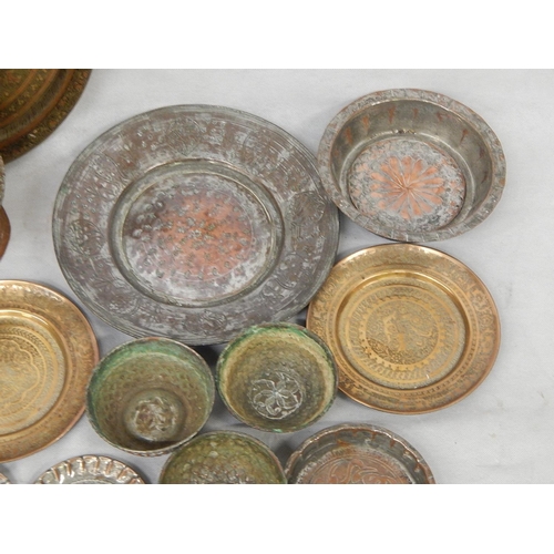 340 - Seventeen brass and tinned copper Indo-Persian dishes and bowls and an
incense burner H 67cm