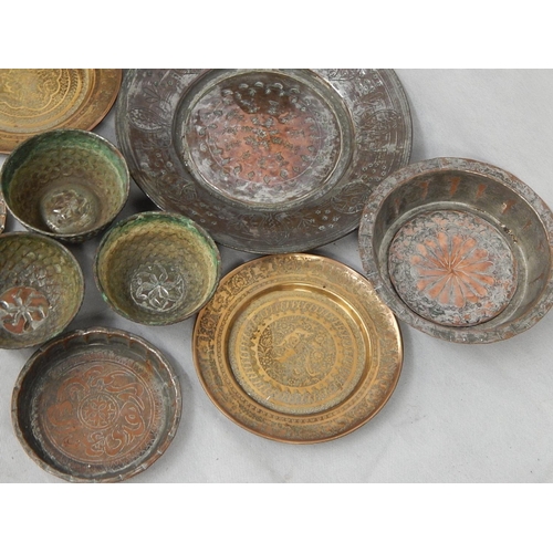 340 - Seventeen brass and tinned copper Indo-Persian dishes and bowls and an
incense burner H 67cm