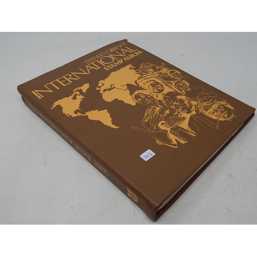 382 - Album containing a large number of UK & Worldwide stamps