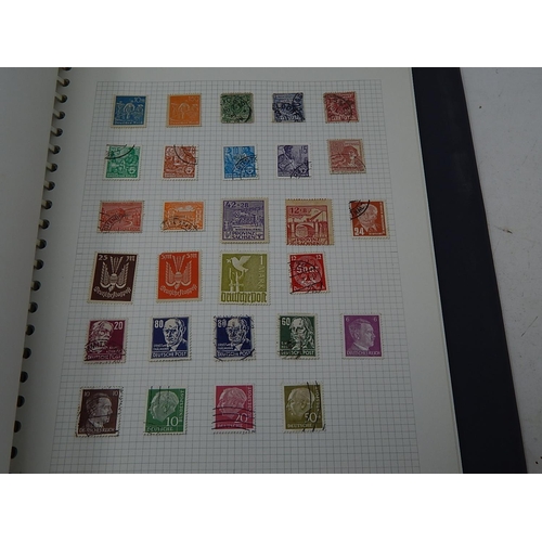 384 - Album containing a large number of & Worldwide stamps