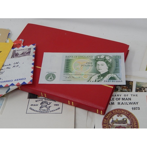 385 - Red stock book containing UK stamps, a further album, FDC's, envelopes etc together with a £1.00 ban... 