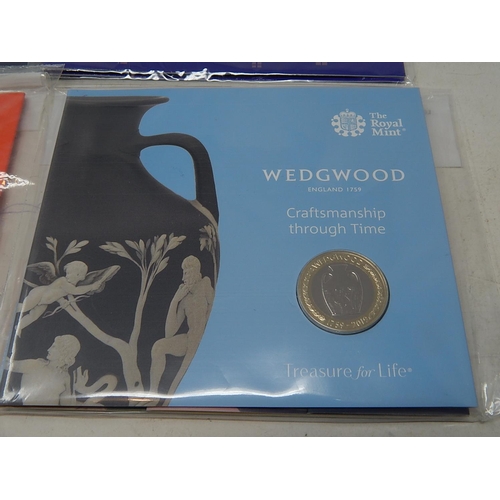 100 - The Gift of Christmas £20 Fine Silver coin; Peter Pan 50 Pence collection; The Pantomime 50p coin co... 