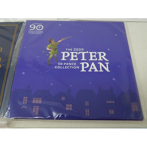 100 - The Gift of Christmas £20 Fine Silver coin; Peter Pan 50 Pence collection; The Pantomime 50p coin co... 