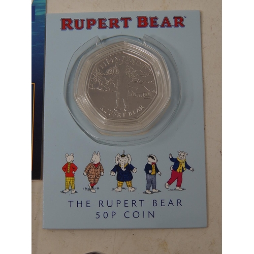 77 - Isle of Man Rupert Bear 50p in blister pack; Jersey/Guernsey 75th Anniversary of Liberation 50p pair... 