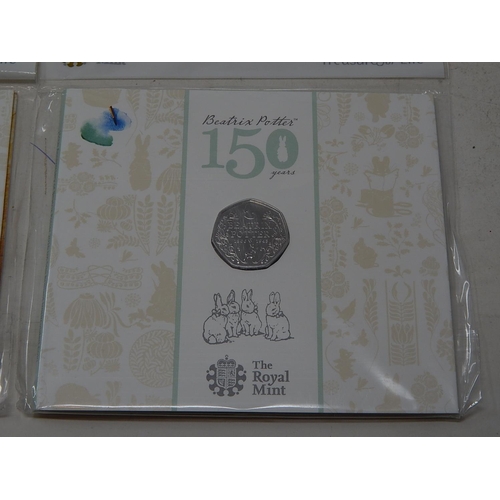 81 - Collection of 8 x Commemorative 50p coins inc Beatrix Potter, Wallice and Gromit etc, all housed in ... 