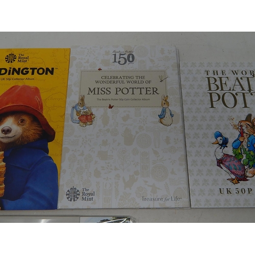 82 - The World of Beatrix Potter collection of 13 x 50p coins in folder; Miss Potter 5 x 50p coins (4 are... 