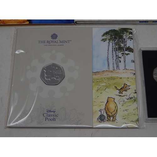 82 - The World of Beatrix Potter collection of 13 x 50p coins in folder; Miss Potter 5 x 50p coins (4 are... 